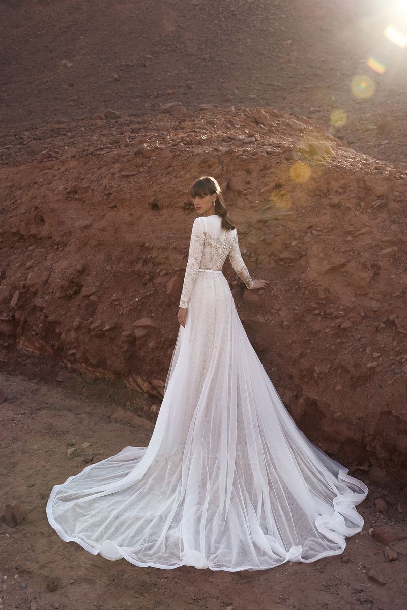 Trailing Tulle — cathedral train spread across desert stone